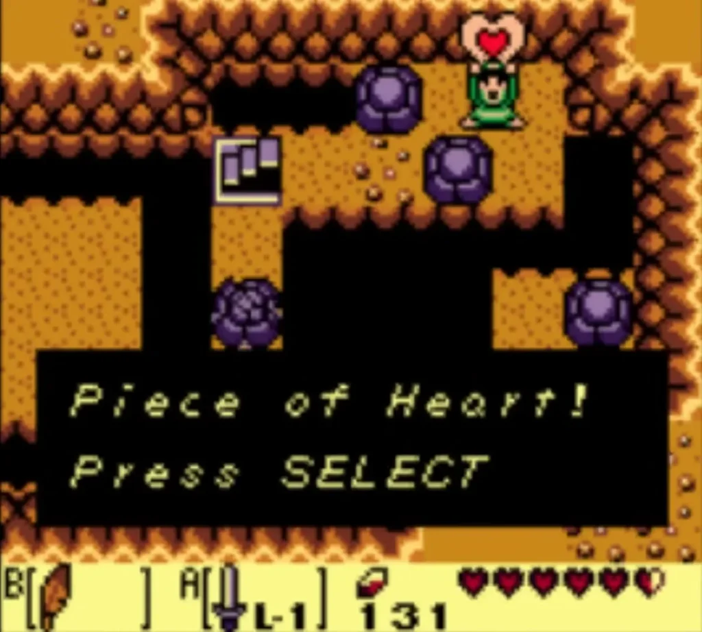 Link holds up the Piece of Heart in the grave cave with the item box fully shown. Link holds up the Piece of Heart in the grave cave with the item box fully shown.