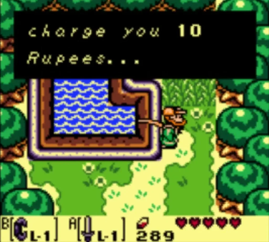 Message box ends 'charge you 10 Rupees...' as Link stands beside the fishing pond Message box ends 'charge you 10 Rupees...' as Link stands beside the fishing pond