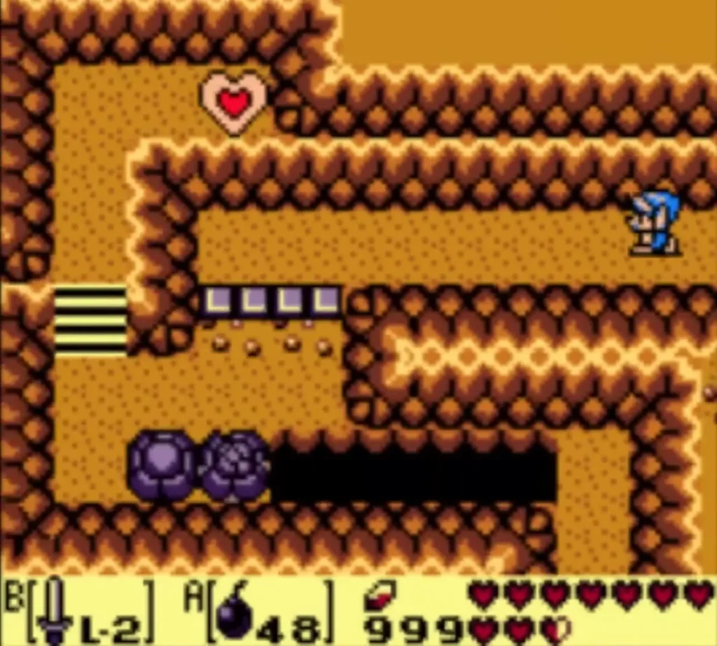 The Piece of Heart sits across a pit as Link stands in the cave beyond the gaps The Piece of Heart sits across a pit as Link stands in the cave beyond the gaps