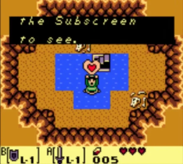 Link holds up a Piece of Heart in the sunken pool of the Mabe well. Link holds up a Piece of Heart in the sunken pool of the Mabe well.