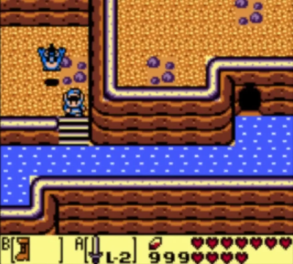 Link stands at the top of the stone stairs on the mountain path, a blue figure on the sand above Link stands at the top of the stone stairs on the mountain path, a blue figure on the sand above