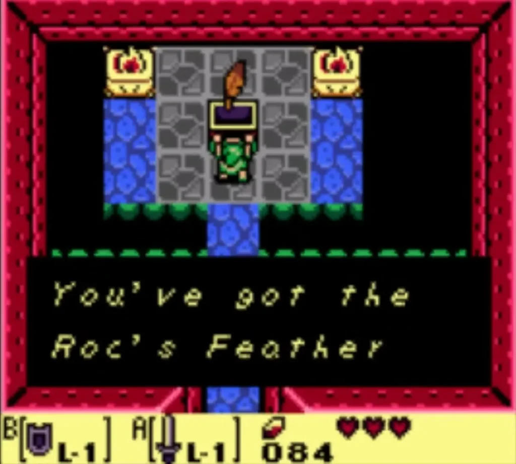 Link holds up the Roc's Feather in Tail Cave as the You've got the Roc's Feather box is shown Link holds up the Roc's Feather in Tail Cave as the You've got the Roc's Feather box is shown