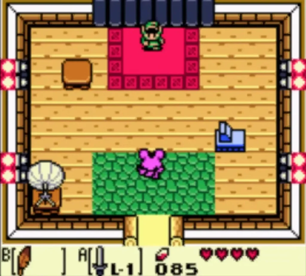 Link on the red carpet inside the Camera Shop east of Goponga Swamp, a pink creature on the green rug below Link on the red carpet inside the Camera Shop east of Goponga Swamp, a pink creature on the green rug below