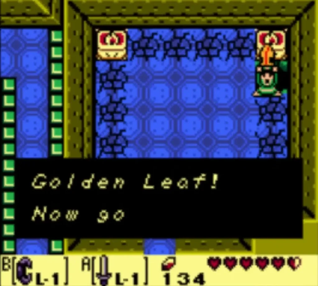 The message box reading Golden Leaf! Now go, with Link holding the leaf overhead in the castle The message box reading Golden Leaf! Now go, with Link holding the leaf overhead in the castle
