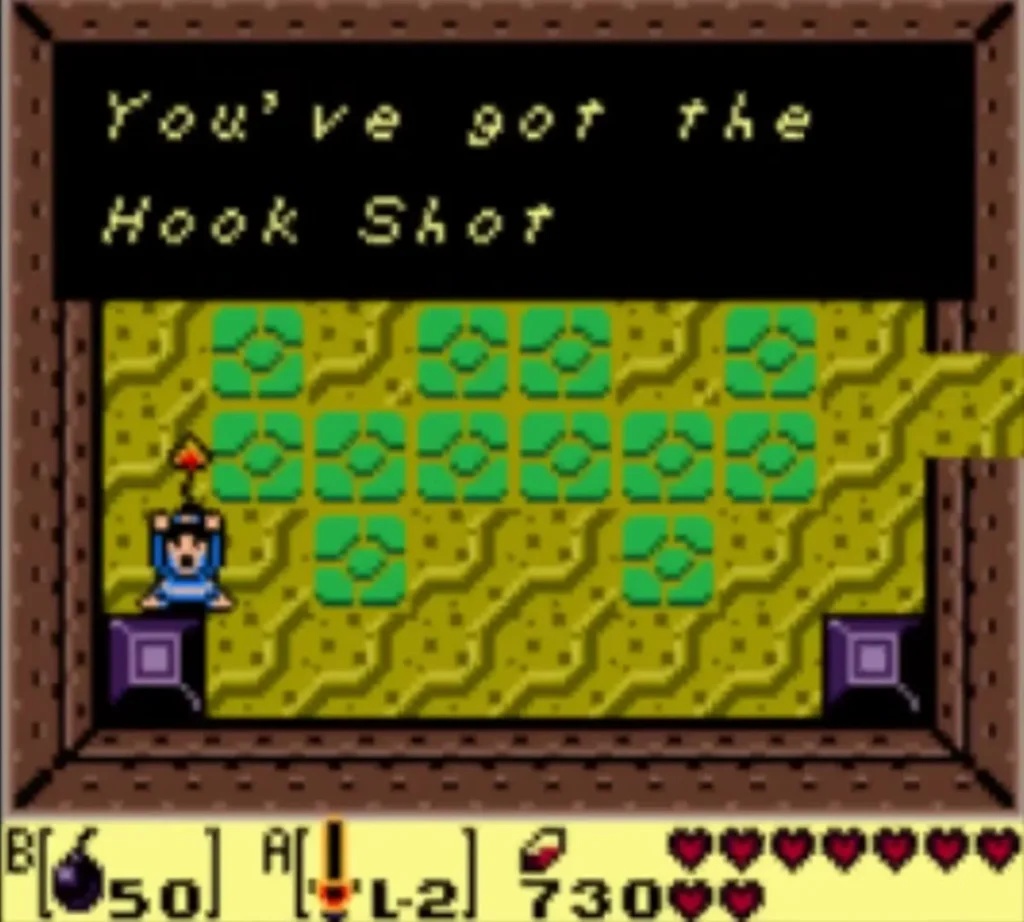 The message box reads You've got the Hook Shot above the tiled room of Catfish's Maw The message box reads You've got the Hook Shot above the tiled room of Catfish's Maw