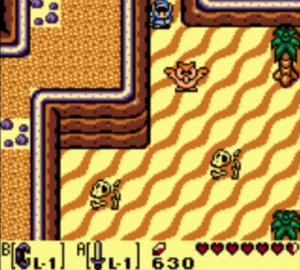 An owl statue standing in the southeast desert sand, with Link at the top of the screen An owl statue standing in the southeast desert sand, with Link at the top of the screen