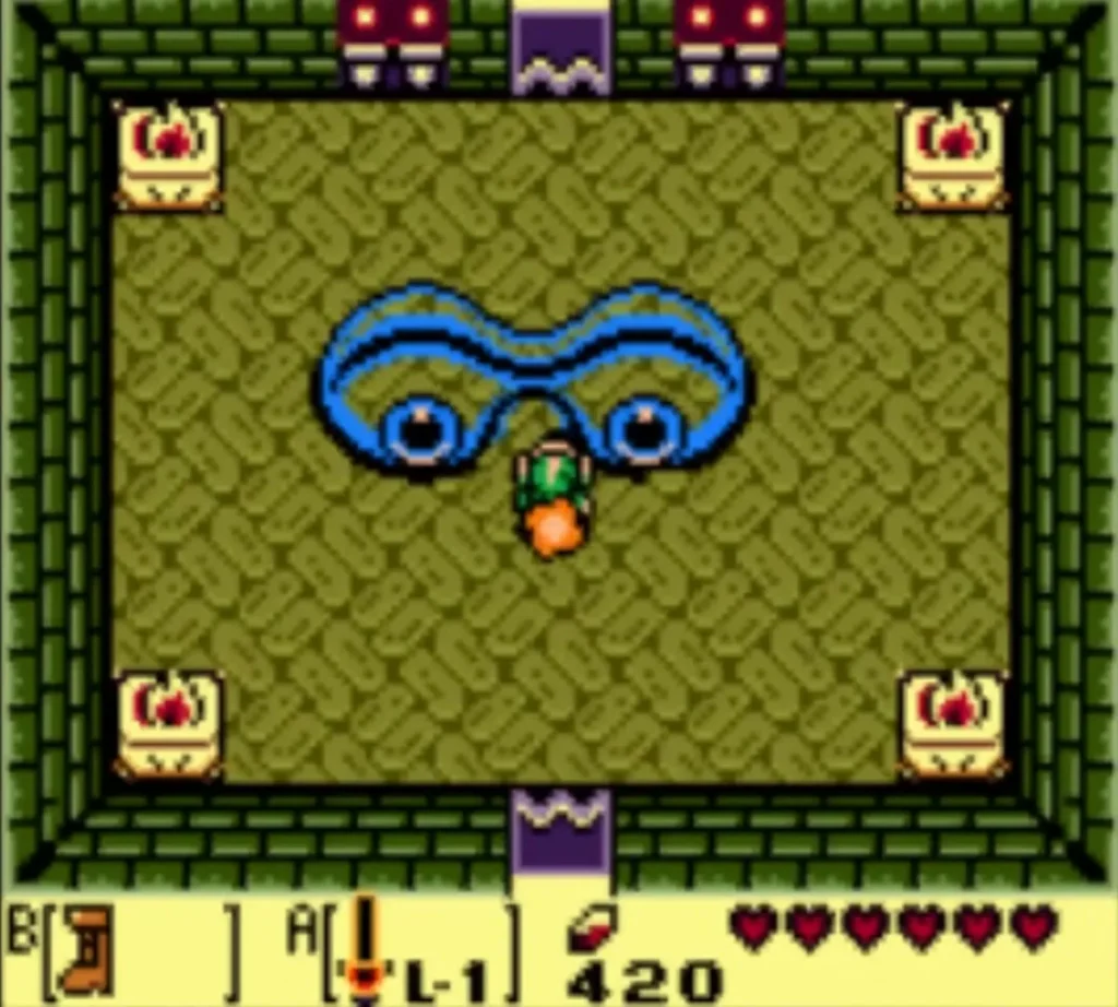 Slime Eye stretched across the boss room of Key Cavern, with Link standing beneath it Slime Eye stretched across the boss room of Key Cavern, with Link standing beneath it