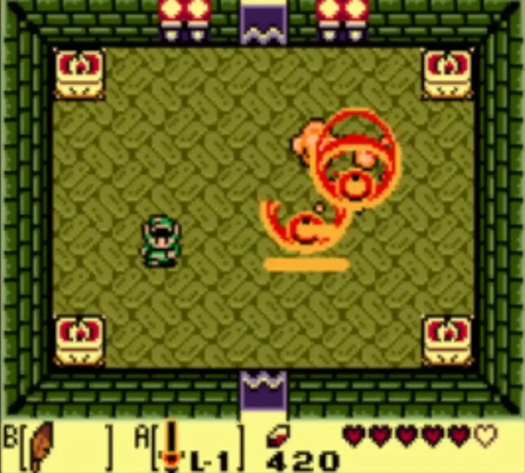 Link faces the Slime Eye as a fiery blob in the Key Cavern boss room Link faces the Slime Eye as a fiery blob in the Key Cavern boss room