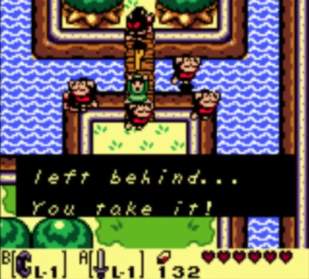 Monkeys' box reads 'left behind... You take it!' as Link stands on the monkey bridge Monkeys' box reads 'left behind... You take it!' as Link stands on the monkey bridge