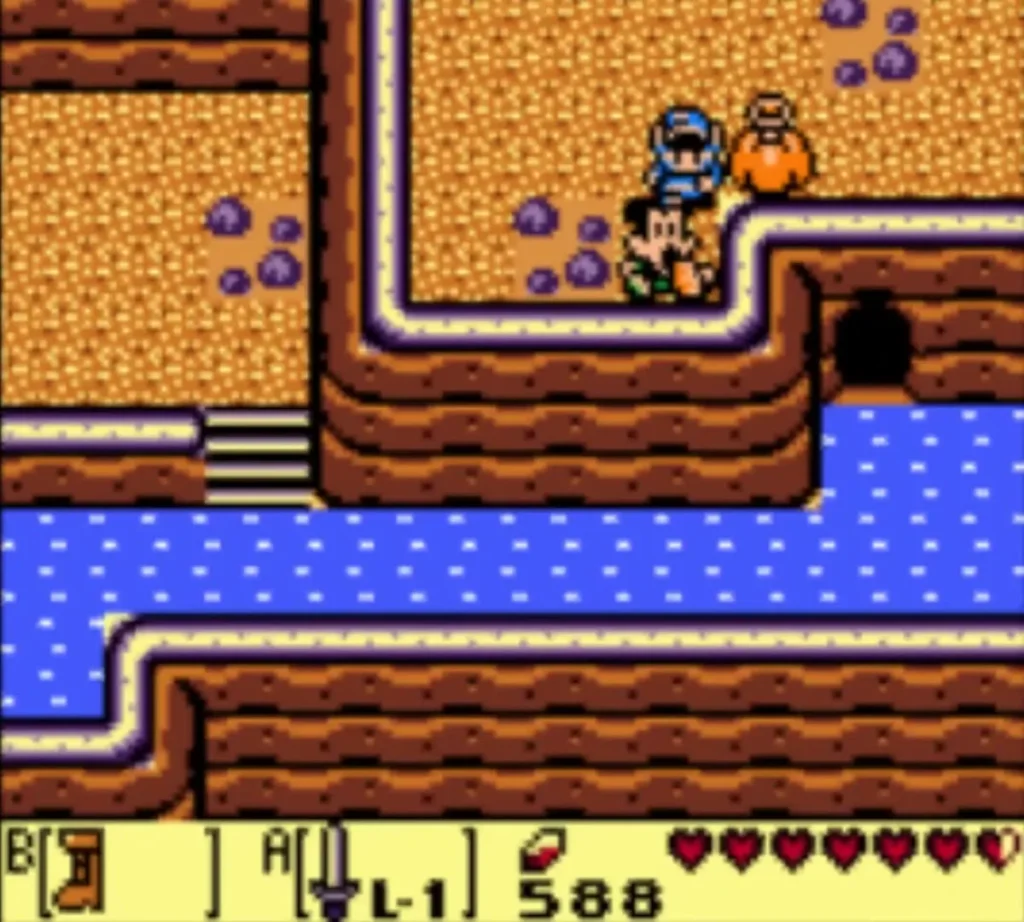 Link and Papahl standing together on a canyon ledge beside a cave Link and Papahl standing together on a canyon ledge beside a cave