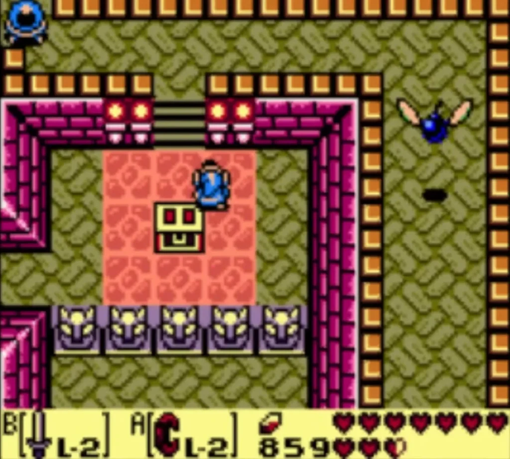 Link above a yellow face block in a room lined with purple statues