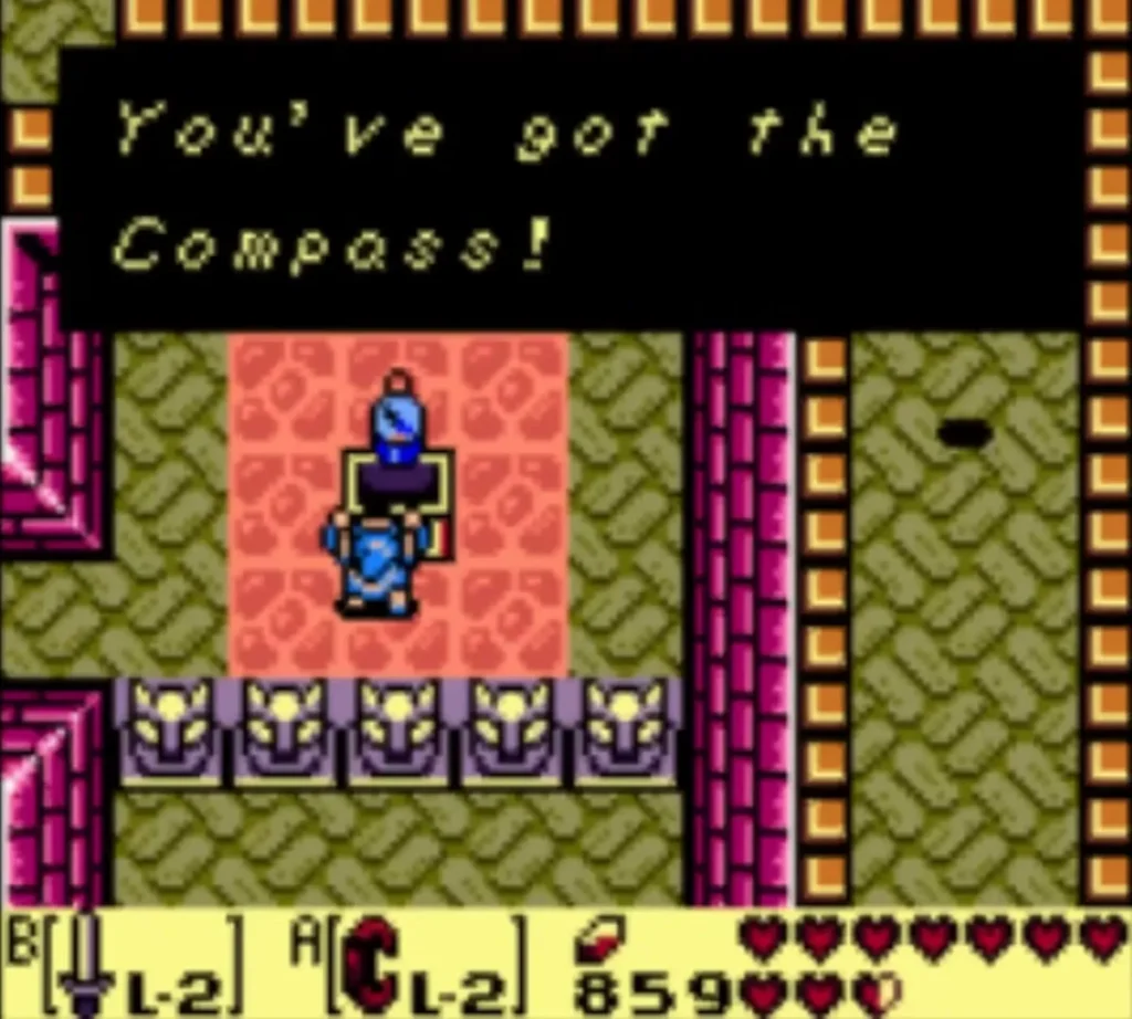Message box reading You've got the Compass!, with Link holding an item overhead
