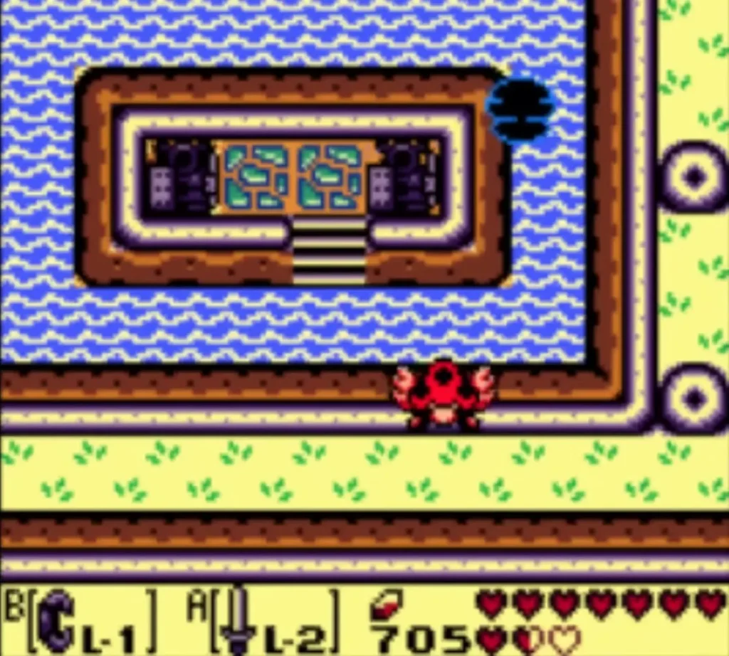 Stone building on a lake island with a red crab on the shore