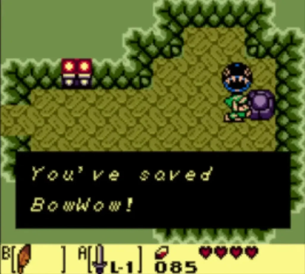Link beside the chained BowWow at the purple rock, with the box reading You've saved BowWow! Link beside the chained BowWow at the purple rock, with the box reading You've saved BowWow!