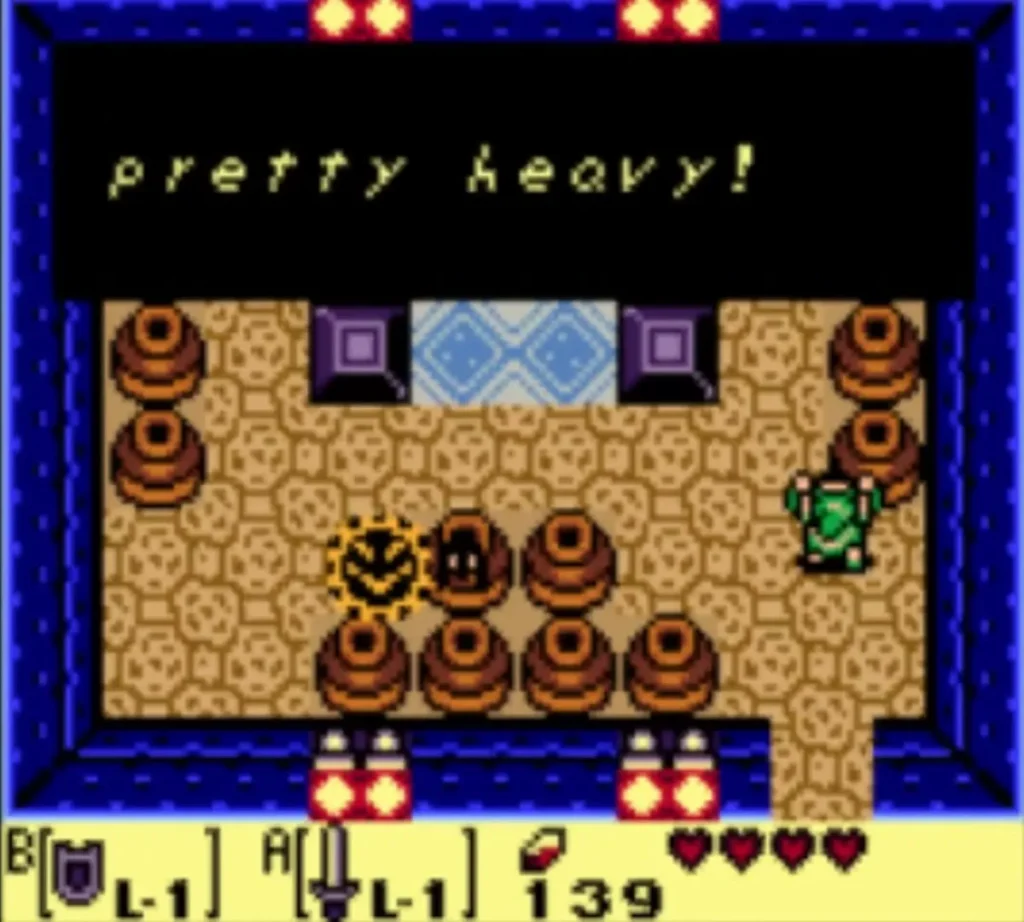The owl statue hint box reading pretty heavy! beside the purple blocks of the block-pushing room The owl statue hint box reading pretty heavy! beside the purple blocks of the block-pushing room