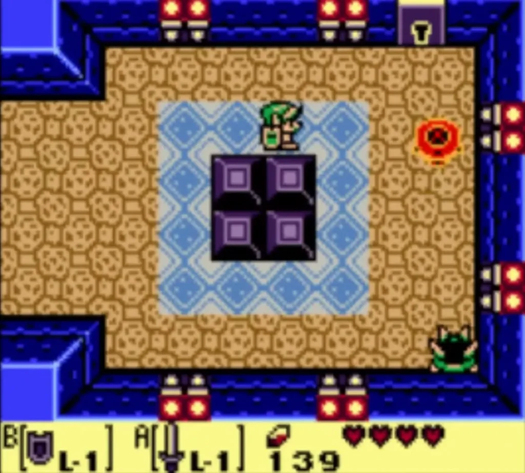 Purple blocks on the blue-tiled floor of the room beyond the locked door, with Link near the top Purple blocks on the blue-tiled floor of the room beyond the locked door, with Link near the top