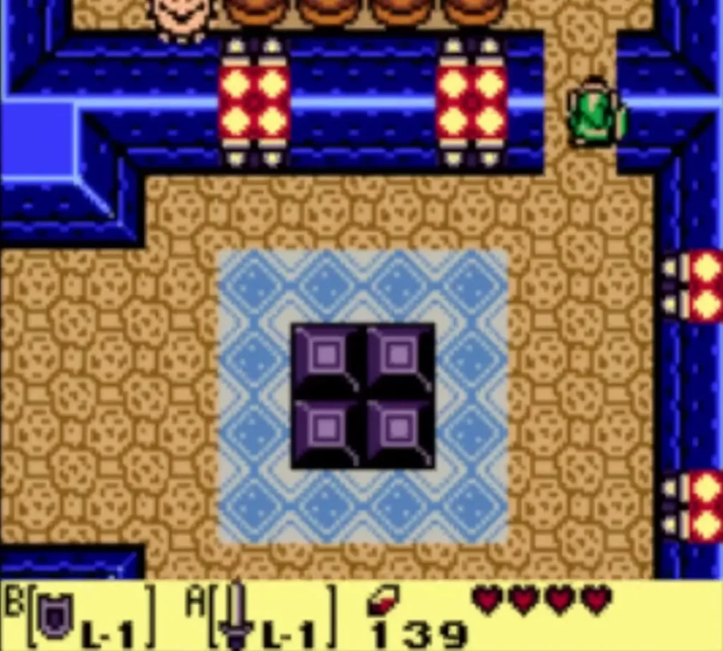 Link at the upper-right entrance of the blue-tiled room with four purple blocks in the middle Link at the upper-right entrance of the blue-tiled room with four purple blocks in the middle