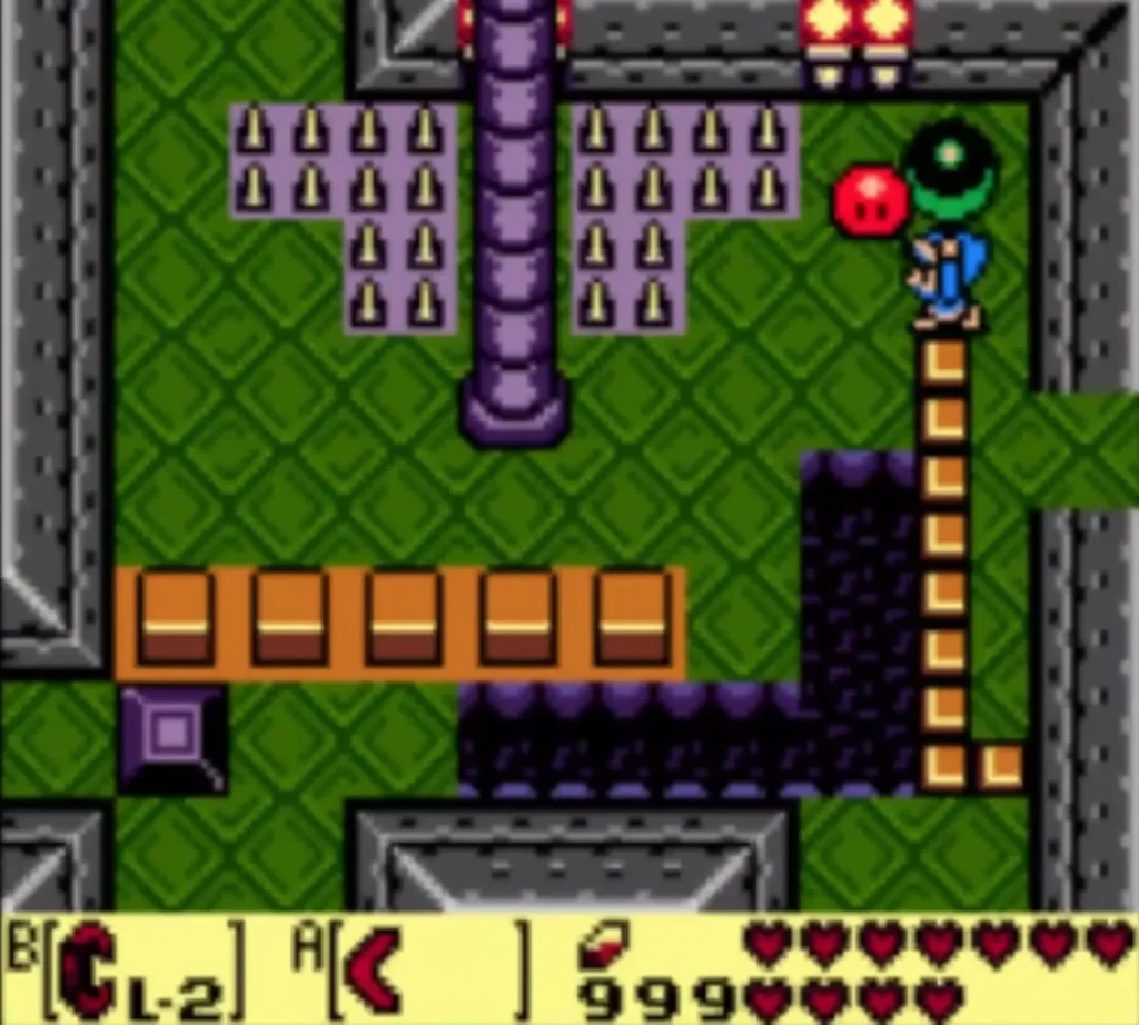 Link beside a tall purple pillar and a red Zol in the room of spiked floors Link beside a tall purple pillar and a red Zol in the room of spiked floors
