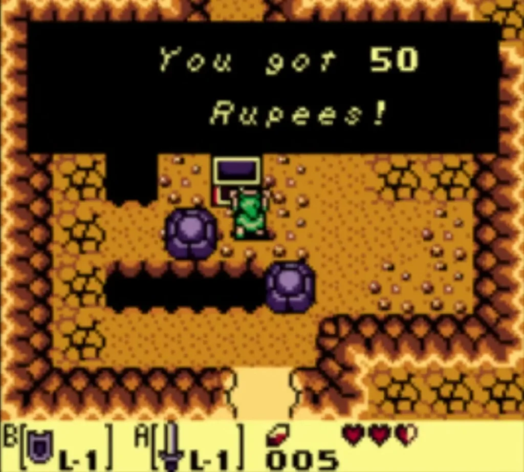 A message box reading You got 50 Rupees! is fully typed beside the opened chest in the log cave A message box reading You got 50 Rupees! is fully typed beside the opened chest in the log cave