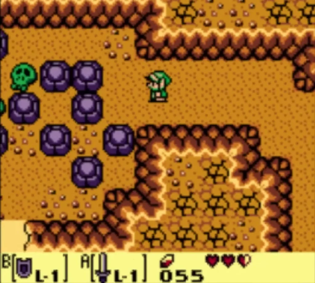 Link in the next log cave room with purple boulders in the way Link in the next log cave room with purple boulders in the way
