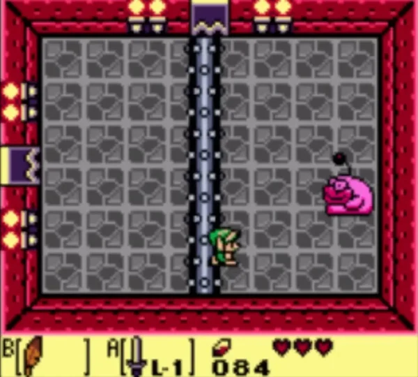 Link stands beside the spiked roller as Rolling Bones moves across the grey floor Link stands beside the spiked roller as Rolling Bones moves across the grey floor
