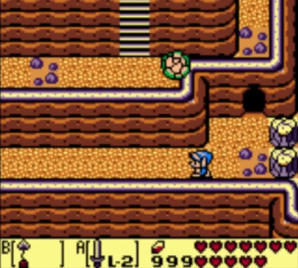 Link at the cave stairs on the cliff with a green enemy nearby Link at the cave stairs on the cliff with a green enemy nearby