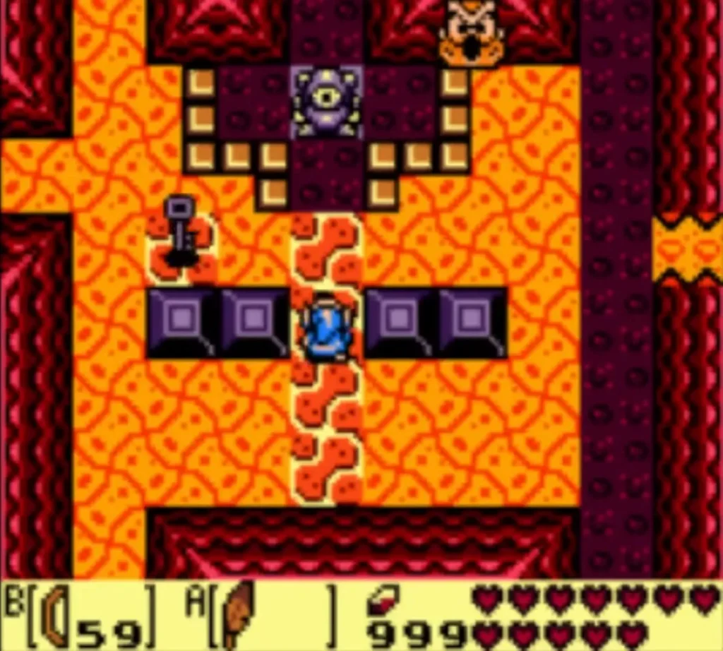 A small key on the lava floor beside an eye statue A small key on the lava floor beside an eye statue
