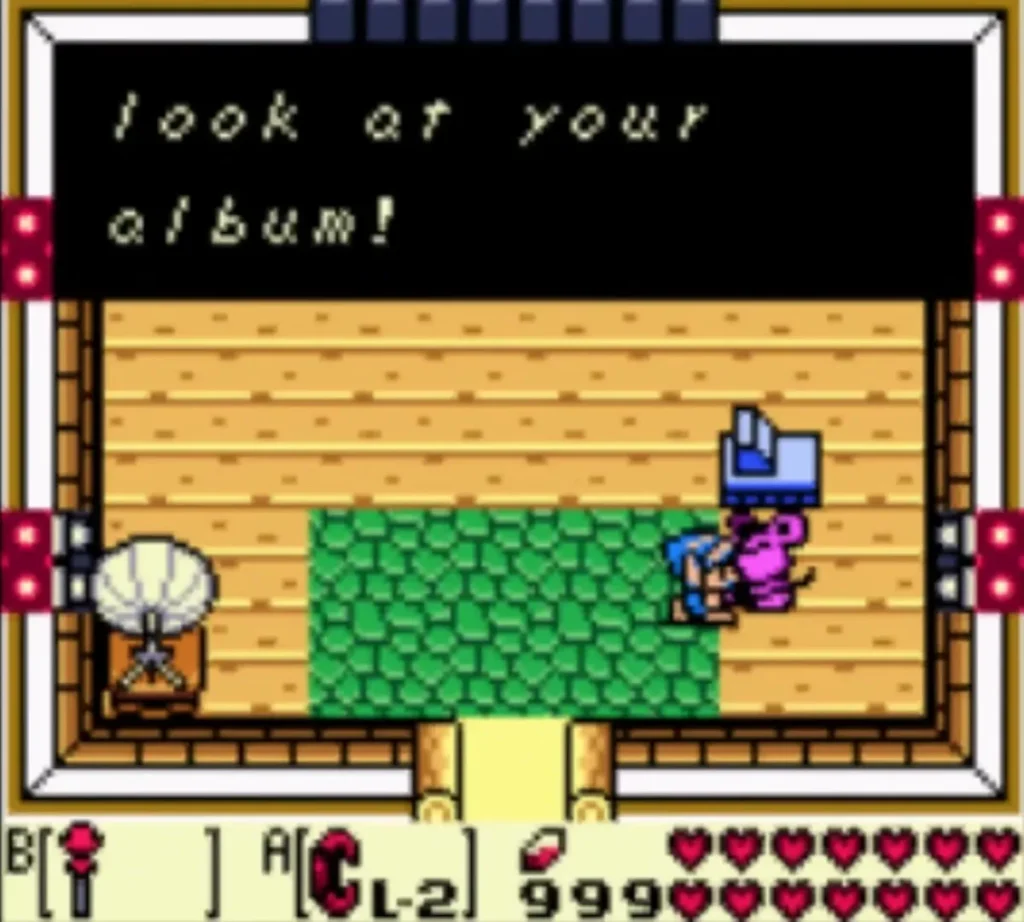 Mouse message box reading look at your album! in the Camera Shop Mouse message box reading look at your album! in the Camera Shop