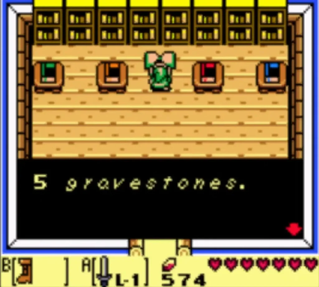 Link stands in the Color Dungeon hall with four chests as a message box reads 5 gravestones. Link stands in the Color Dungeon hall with four chests as a message box reads 5 gravestones.