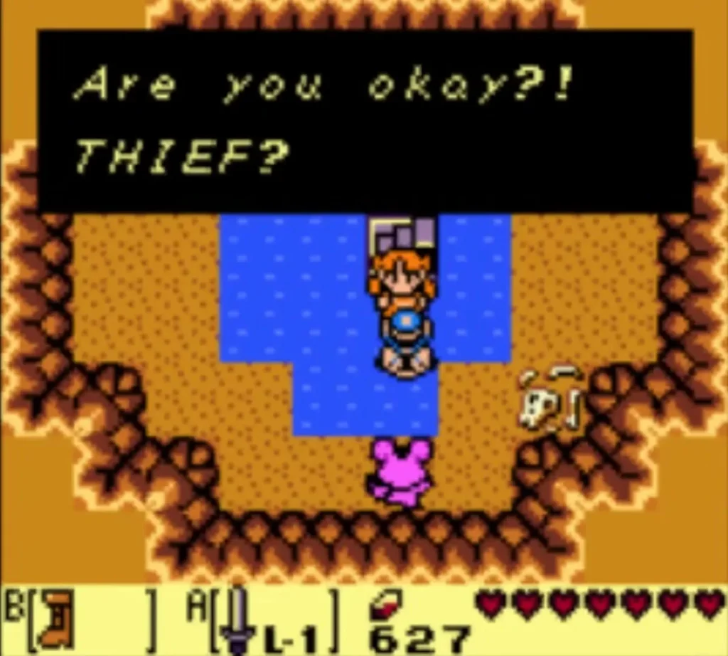 Marin in the sand pit by the water, with an Are you okay message box on screen Marin in the sand pit by the water, with an Are you okay message box on screen