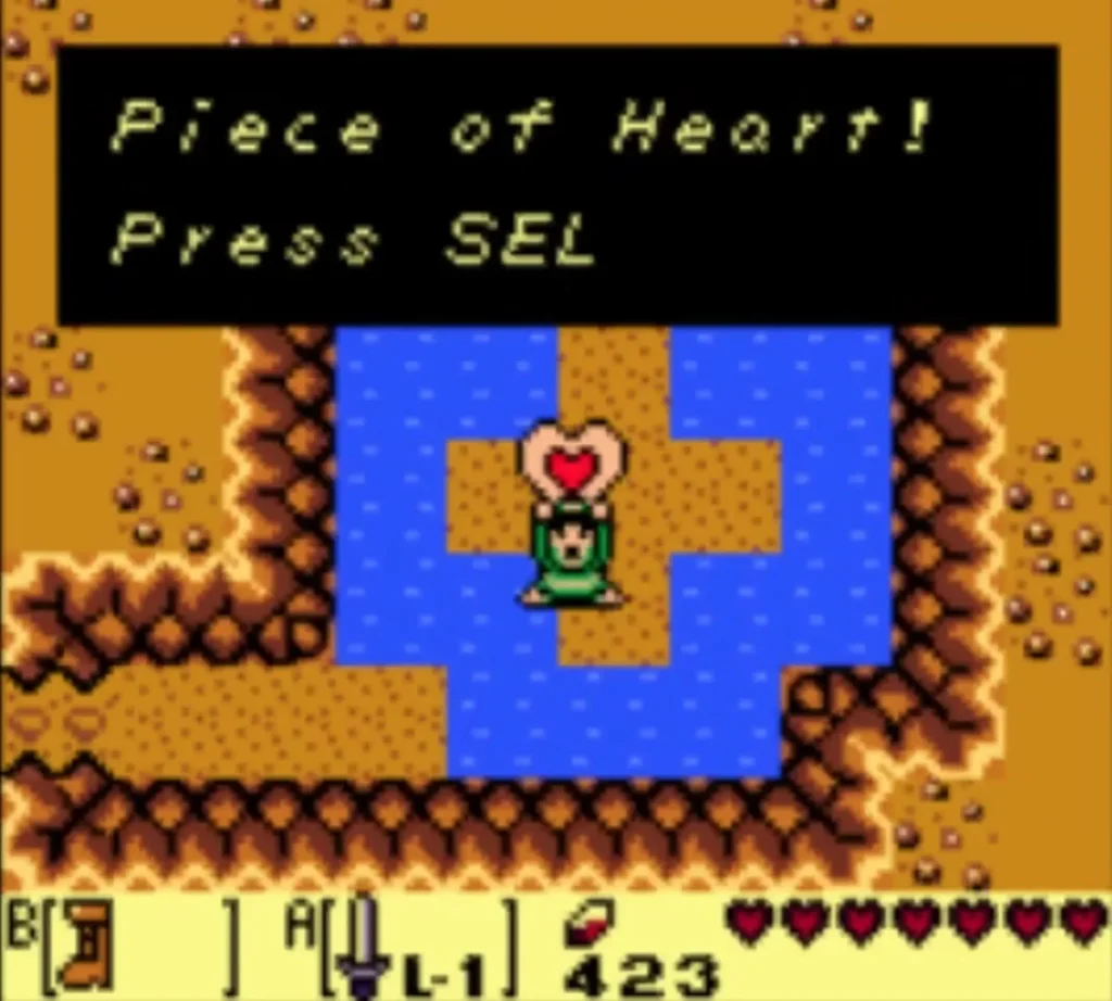 Link holding up a Piece of Heart with the name box on screen Link holding up a Piece of Heart with the name box on screen