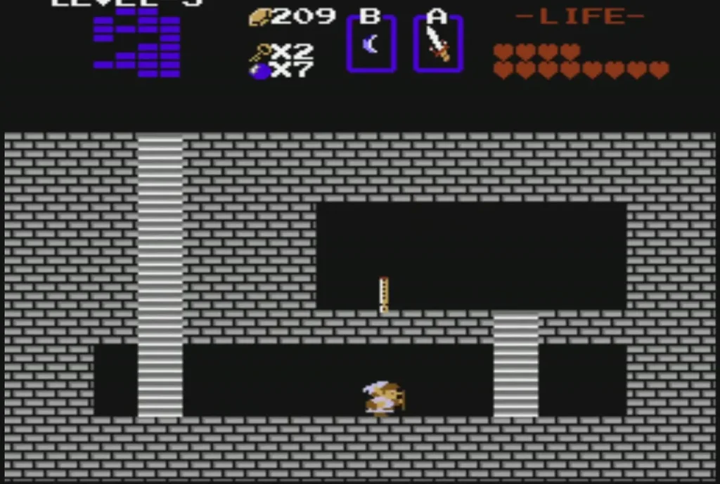 Link beside a small gold key in a grey-brick Level 5 room