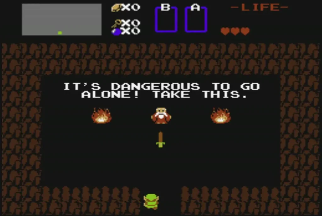 Old Man in the first cave between two fires with the words It's dangerous to go alone Old Man in the first cave between two fires with the words It's dangerous to go alone