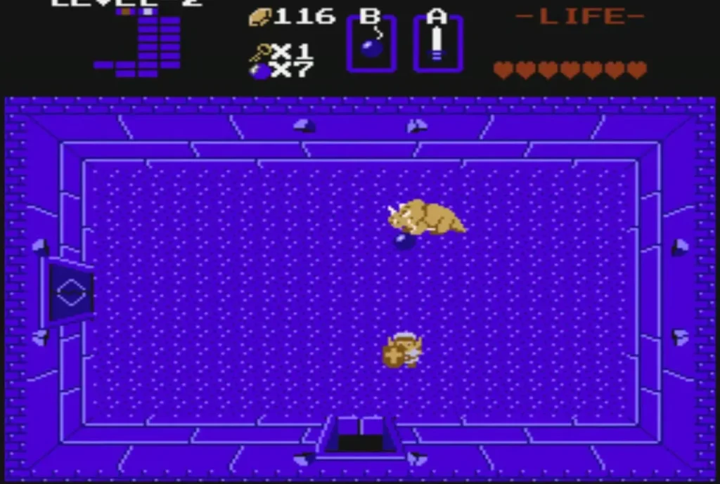 Link fighting the golden Dodongo boss in the Level 2 boss room Link fighting the golden Dodongo boss in the Level 2 boss room