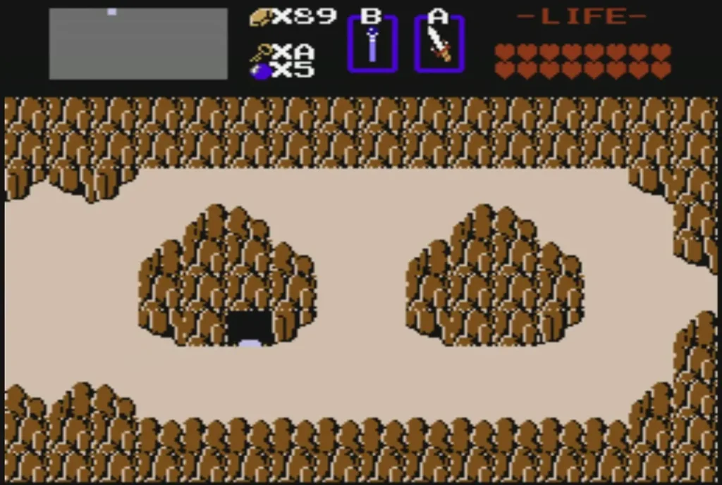 Dark cave entrance at the foot of a rock mound on the overworld Dark cave entrance at the foot of a rock mound on the overworld