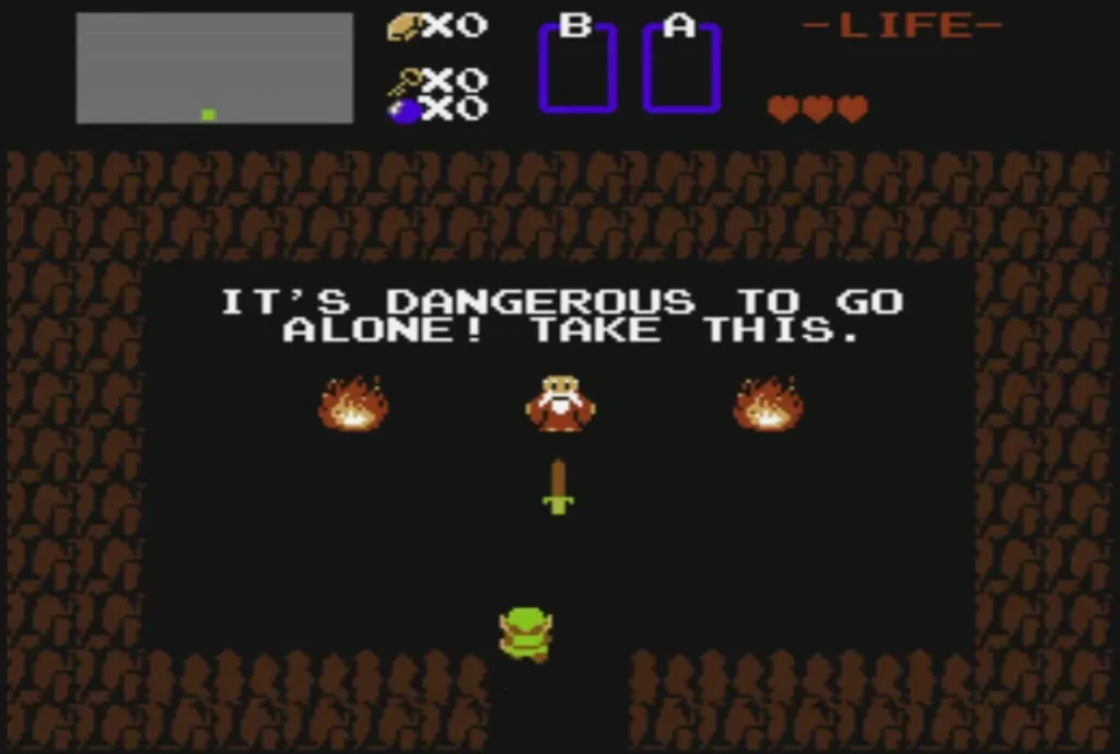 An old man in a cave between two fires holding out a sword to Link An old man in a cave between two fires holding out a sword to Link
