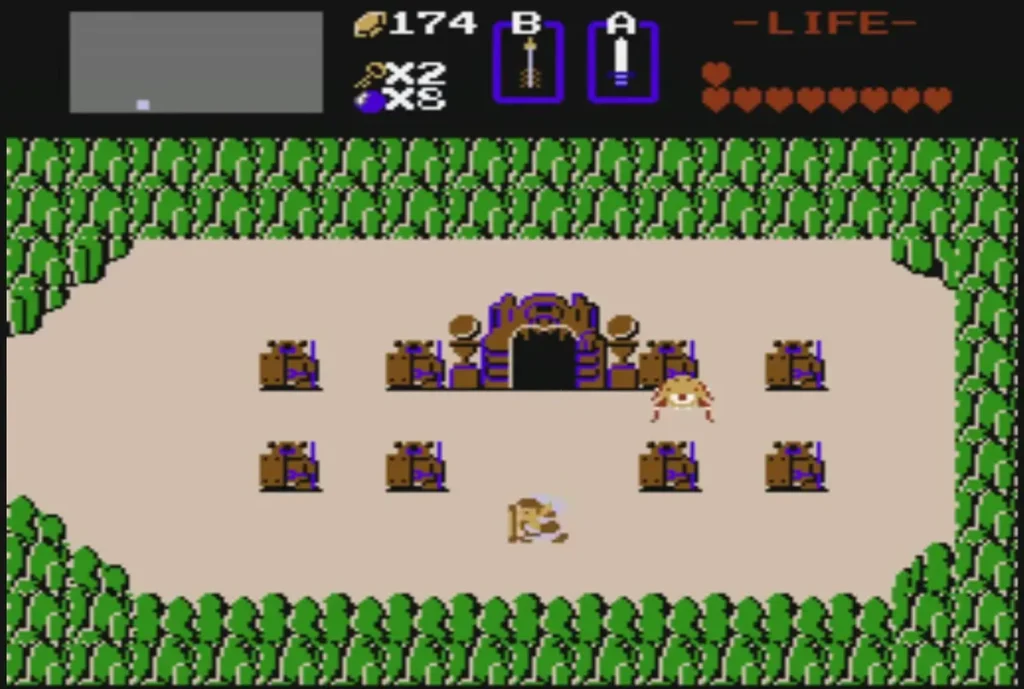 Link back on the sand field outside the Level 3 stone gate, with boulders and enemies nearby