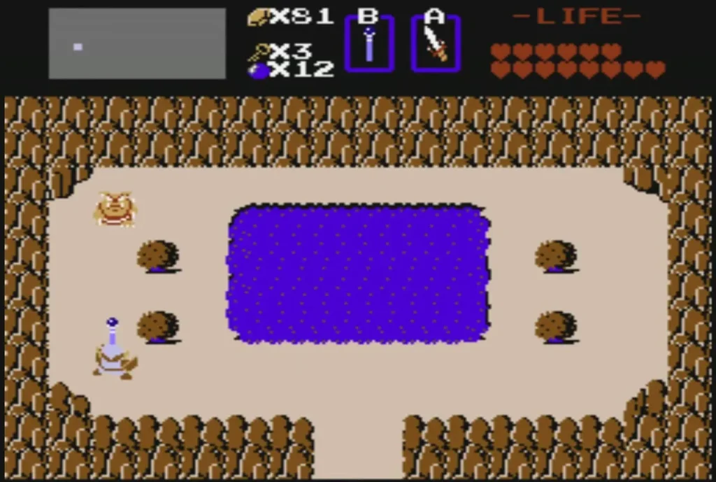 Purple lake with four round boulders around its edges on the sand Purple lake with four round boulders around its edges on the sand