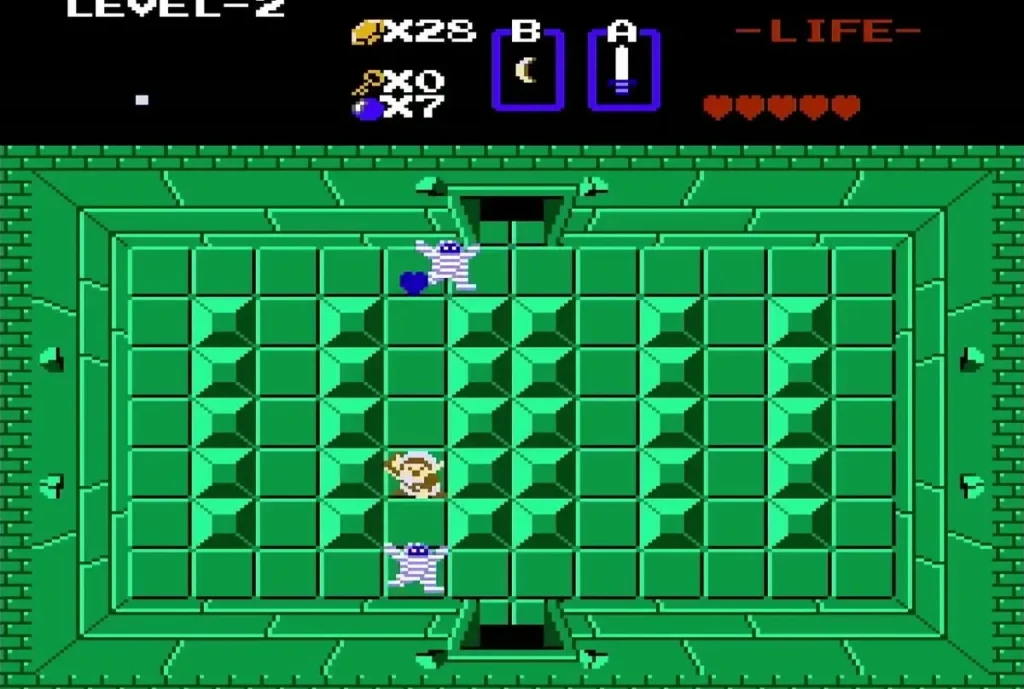 Link near the bottom of a green Level 2 room with Gibdo mummies above him Link near the bottom of a green Level 2 room with Gibdo mummies above him