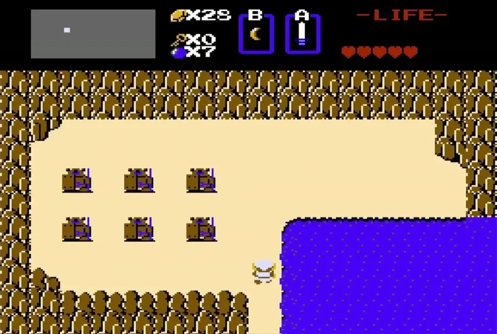 Link on the sand beside the lake in the field of Armos statues in the west of the overworld Link on the sand beside the lake in the field of Armos statues in the west of the overworld