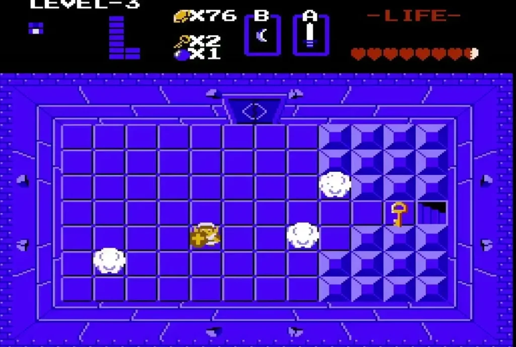 Wallmasters drifting across the key room of Level 3, with a small key on the floor