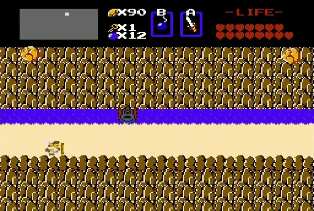 Link on the river bank beside the cliff in Level 8's approach Link on the river bank beside the cliff in Level 8's approach