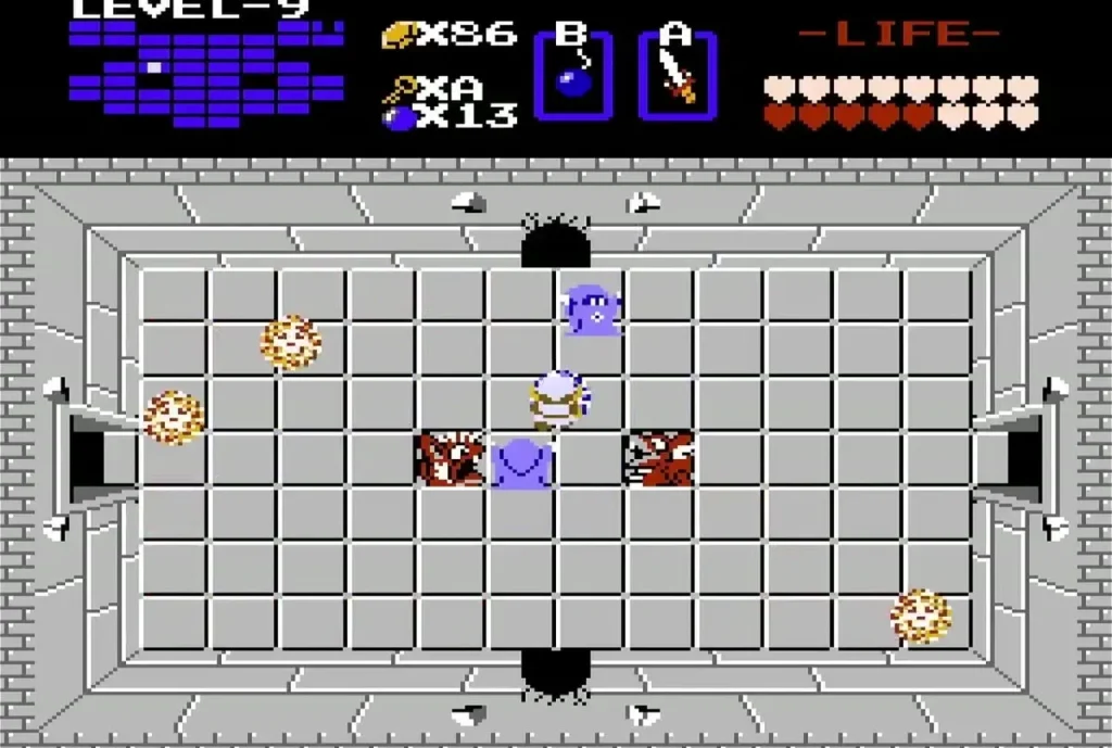 Wizzrobes and gold items in a Level 9 room with bottom passage Wizzrobes and gold items in a Level 9 room with bottom passage