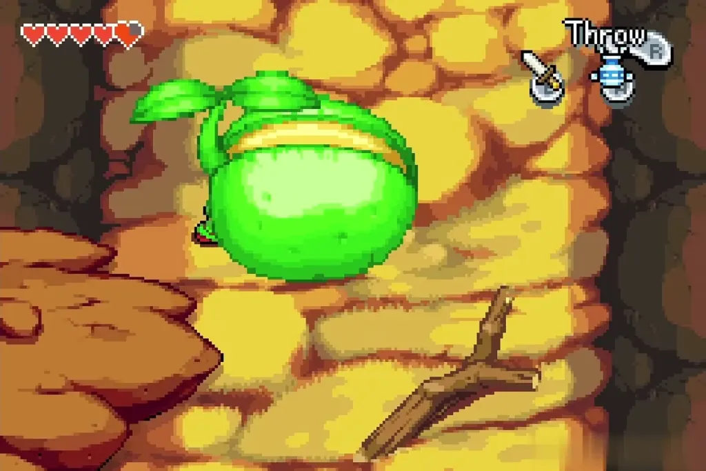 A giant green bean sprout lying on the cobbled Minish path at the base of Mt. Crenel