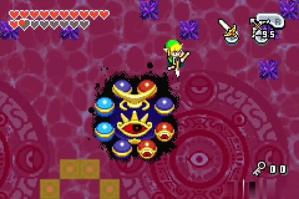 Red and blue orbs around Vaati's eye with a block layout below Red and blue orbs around Vaati's eye with a block layout below