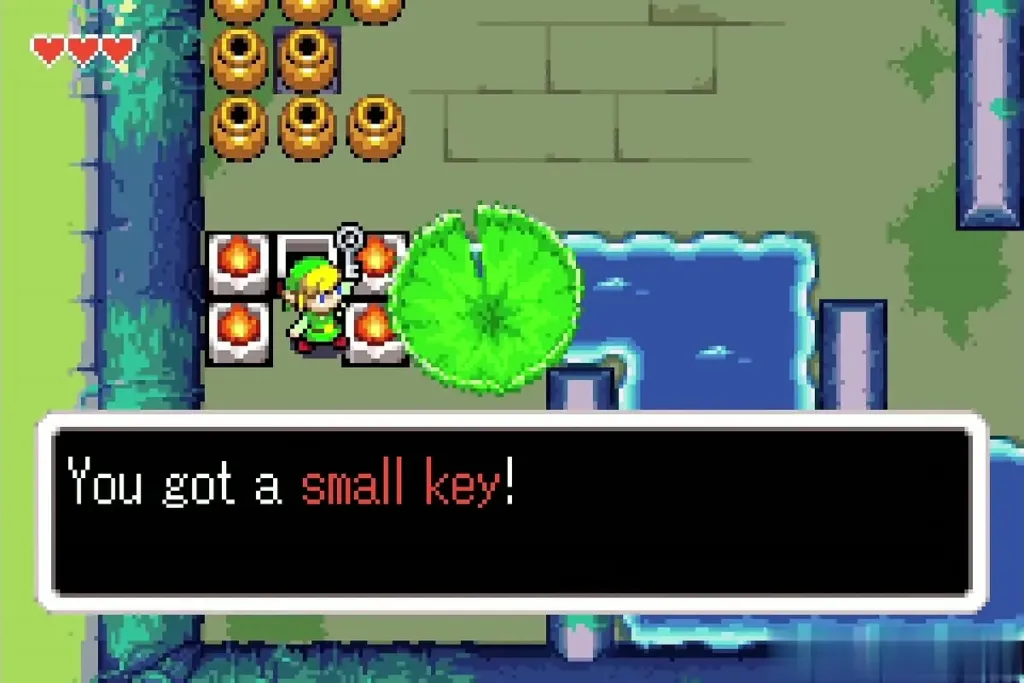 Link holding up a small key after the item-get message in the lily pad water section Link holding up a small key after the item-get message in the lily pad water section