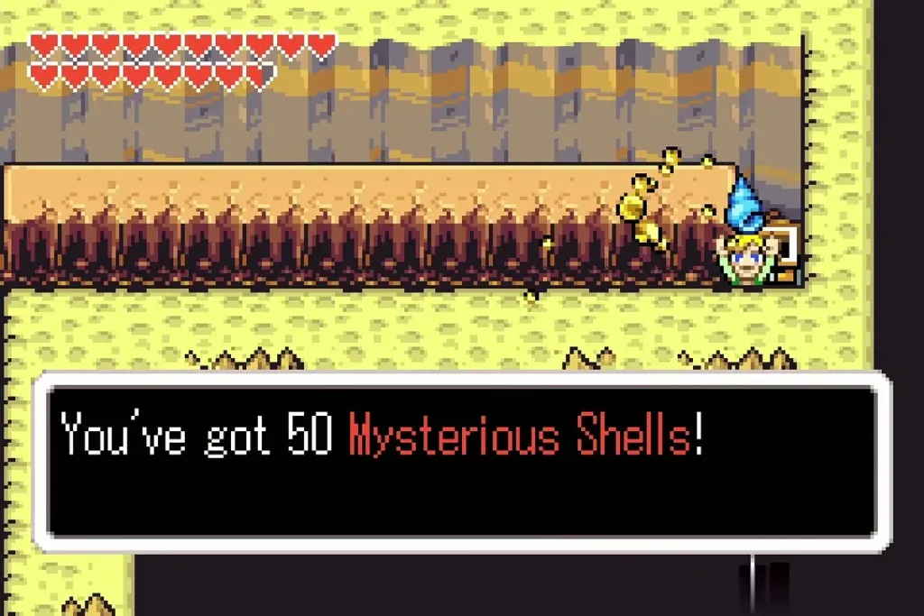 Link holding up 50 Mysterious Shells beside a chest on a high ledge Link holding up 50 Mysterious Shells beside a chest on a high ledge