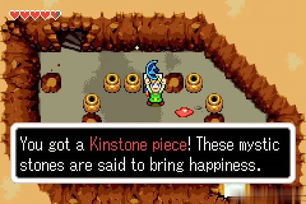 Link holding up a Kinstone piece, with the message You got a Kinstone piece Link holding up a Kinstone piece, with the message You got a Kinstone piece