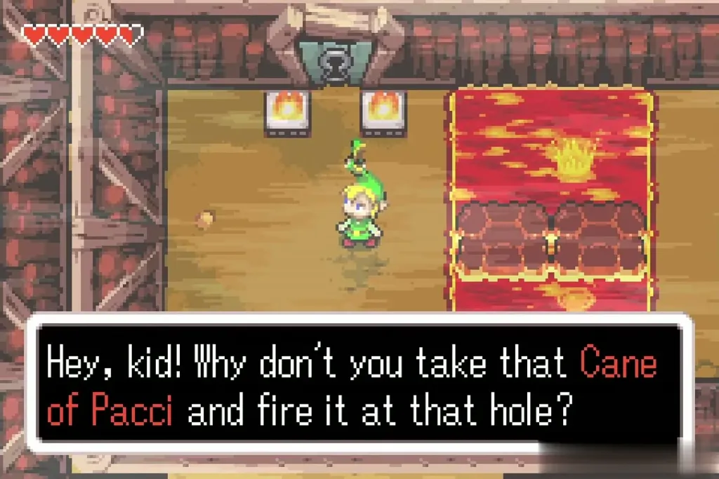 Ezlo telling Link to fire the Cane at the hole by the lava Ezlo telling Link to fire the Cane at the hole by the lava