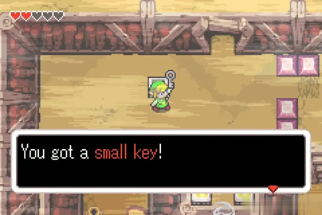 Link holding up the first Small Key with the message fully shown Link holding up the first Small Key with the message fully shown